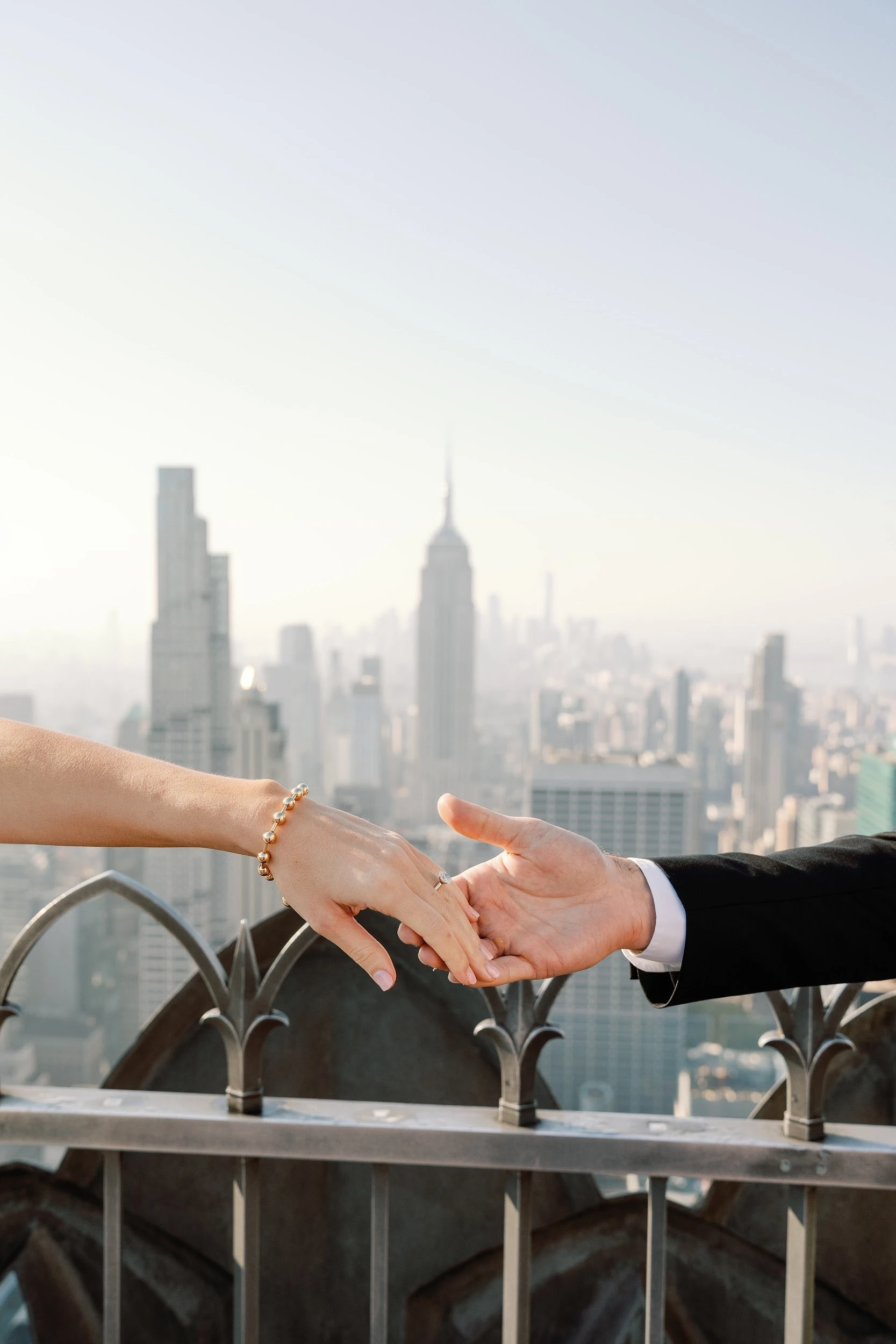 Bride and groom pose in New York